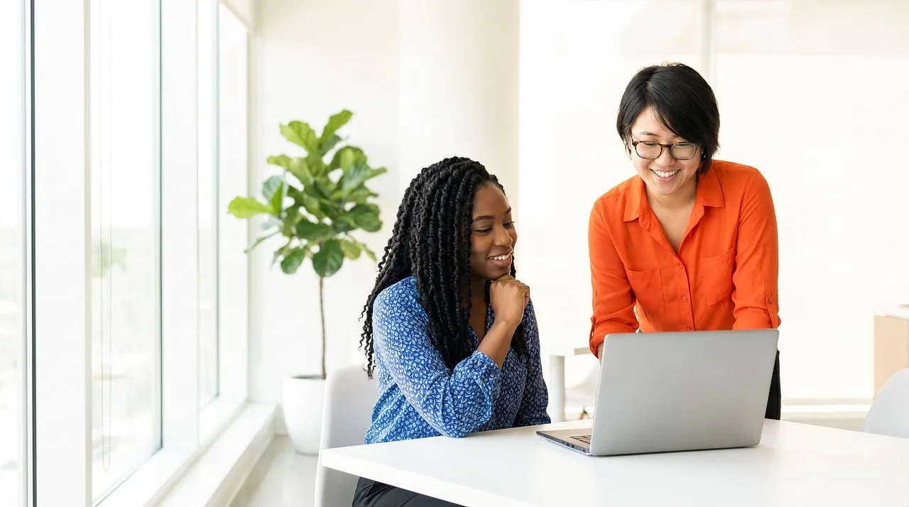 women, professionals, collaboration, teamwork, office, meeting, computer, laptop, nature, smiling, diversity, happy, modern, workplace, learning, discussion, communication, business, technology, indoor, plant
